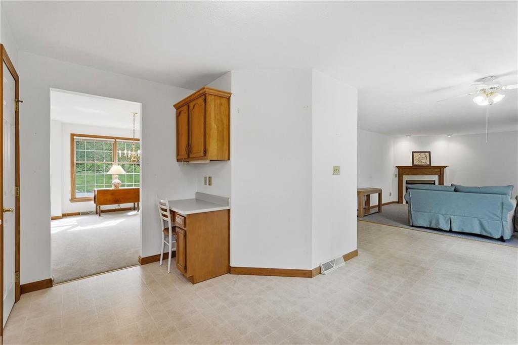 114 Sika Drive Pittsburgh, PA 15239 - Photo 17 of 45 a view of a kitchen with furniture and a ceiling fan
