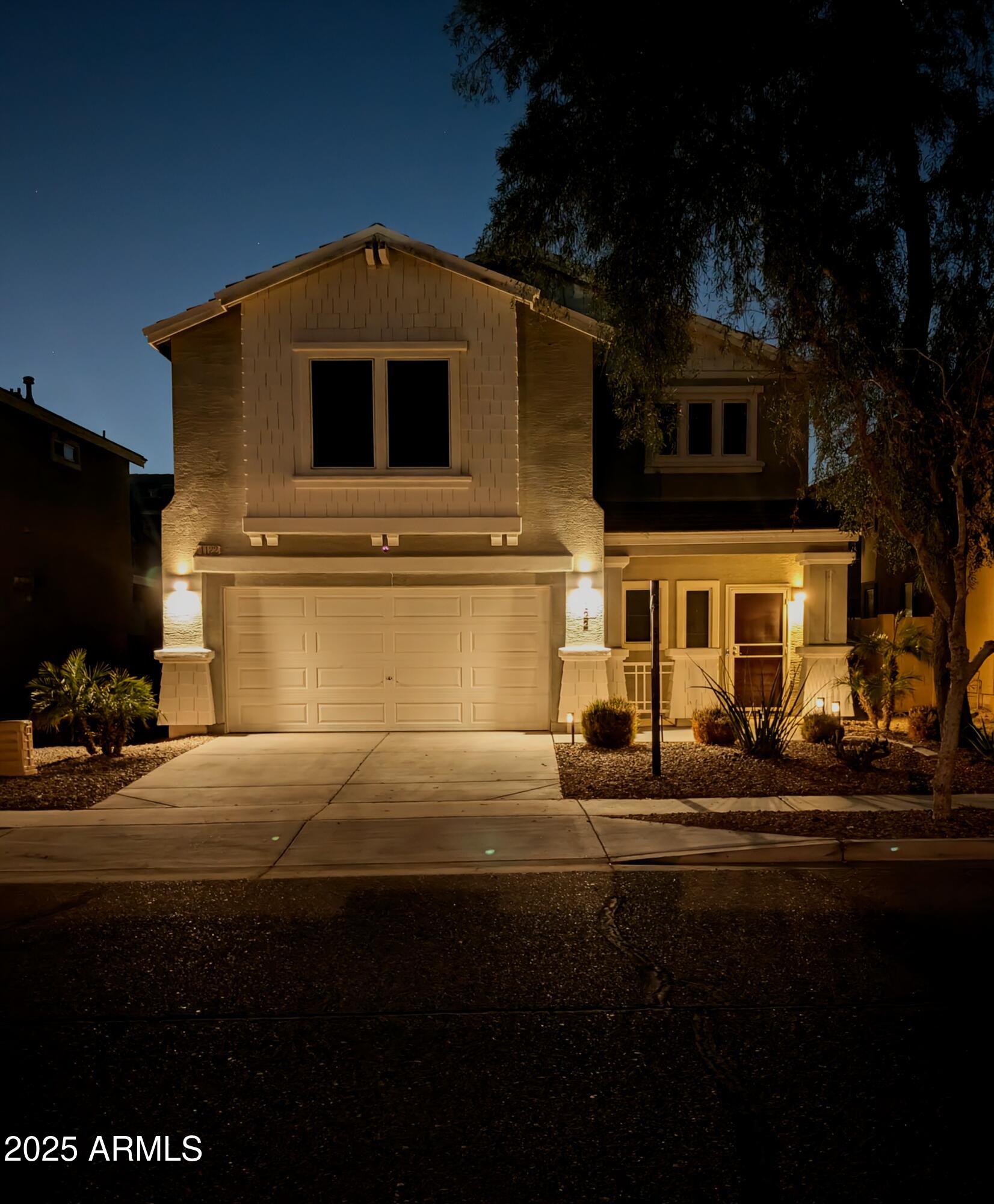 4122 West Carter Road Phoenix, AZ 85041 - Photo 1 of 7 a front view of a house with a yard
