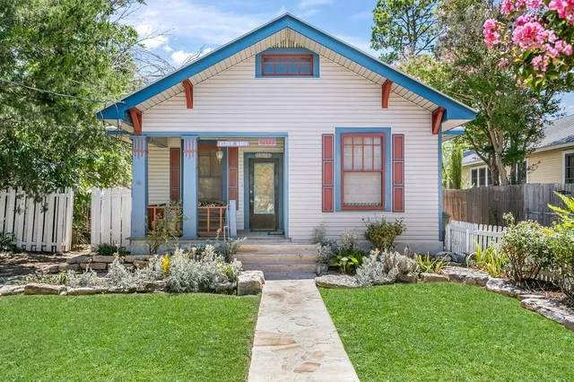 a front view of a house with garden