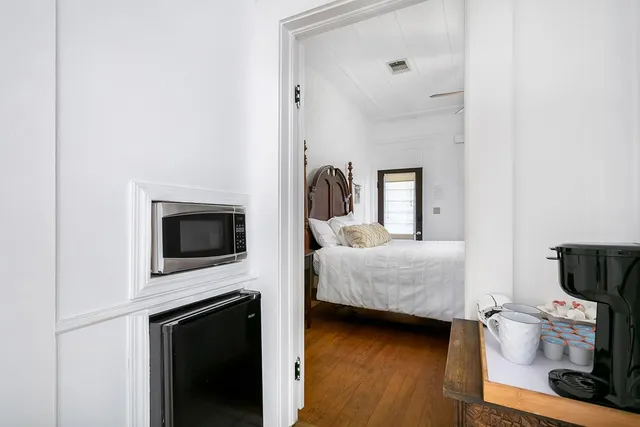 a en suite bathroom with a toilet sink and mirror
