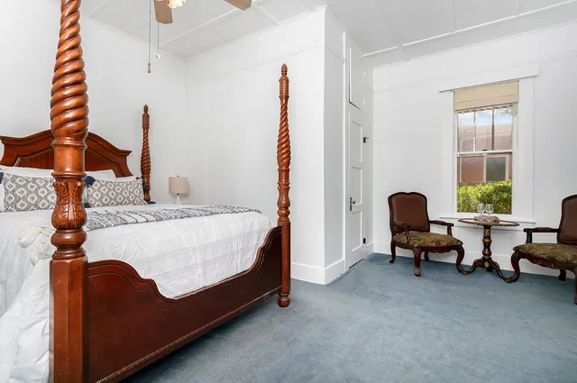 a bed room with a bed and a window