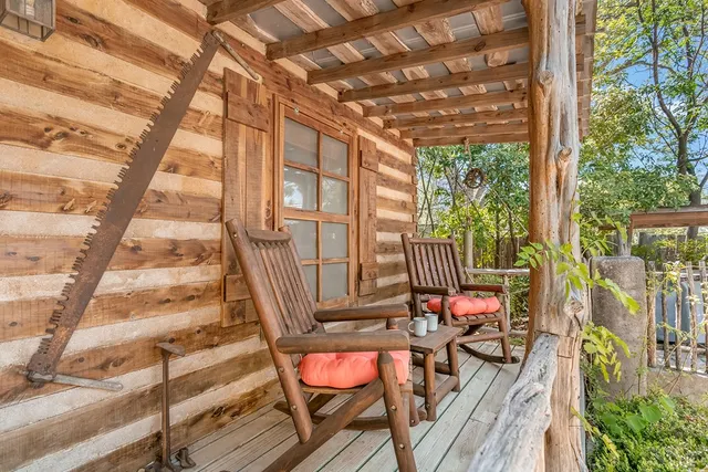 a balcony with wooden floor and outdoor space