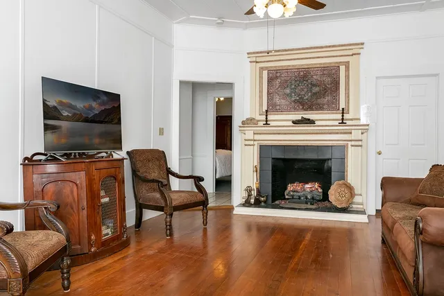 a living room with furniture and a fireplace