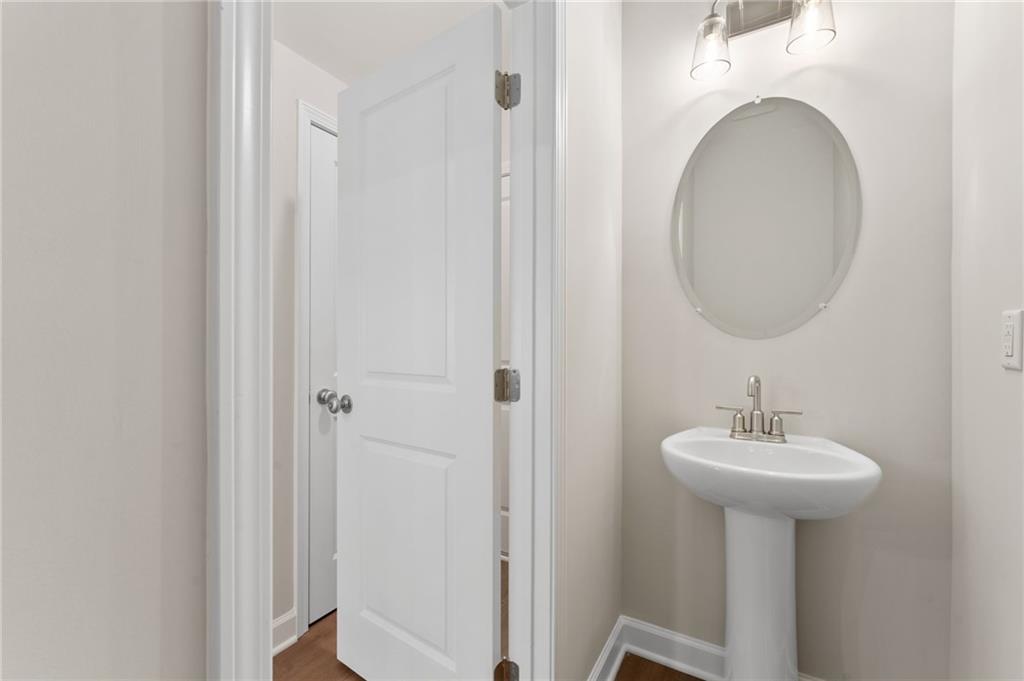 4659 Larkfield Way, Unit 15 Powder Springs, GA 30127 - Photo 12 of 60 a bathroom with a sink and a mirror