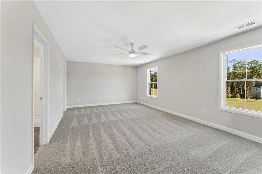 4659 Larkfield Way, Unit 15 Powder Springs, GA 30127 - Photo 13 of 60 an empty room with windows and entrance