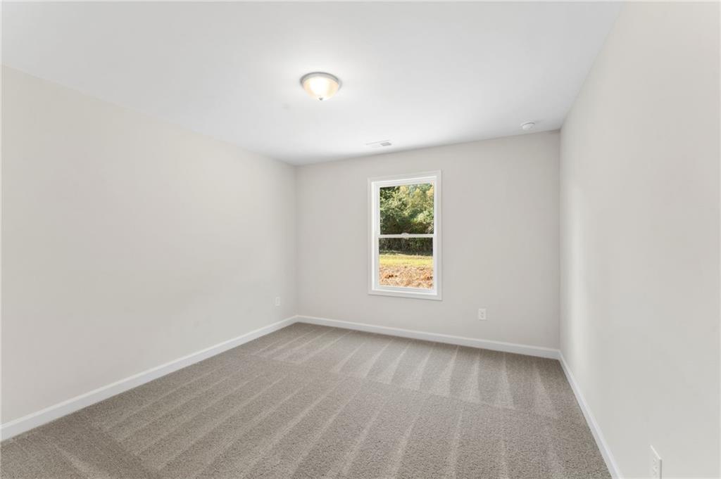 4659 Larkfield Way, Unit 15 Powder Springs, GA 30127 - Photo 18 of 60 an empty room with a window