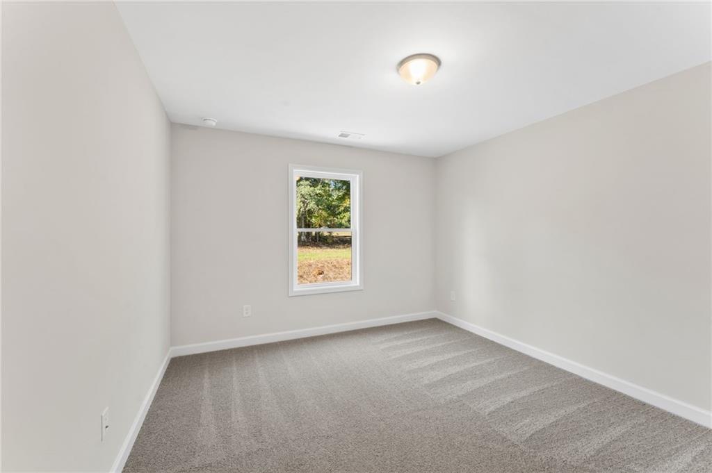 4659 Larkfield Way, Unit 15 Powder Springs, GA 30127 - Photo 20 of 60 an empty room with a window