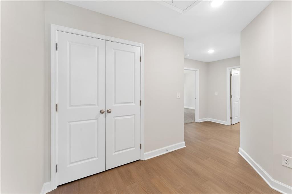 4659 Larkfield Way, Unit 15 Powder Springs, GA 30127 - Photo 23 of 60 an empty room with wooden floor