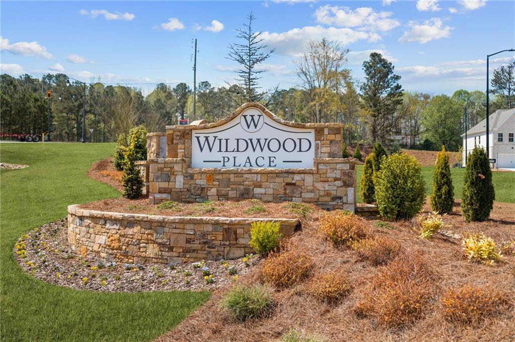 4659 Larkfield Way, Unit 15 Powder Springs, GA 30127 - Photo 26 of 60 a view of a park that has a sign board large trees