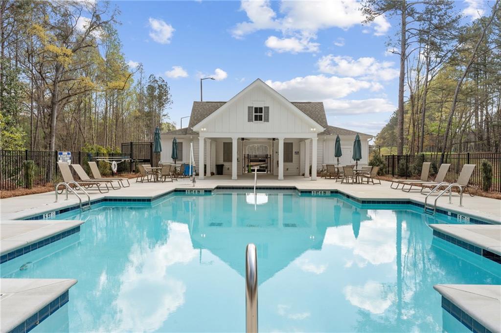 4659 Larkfield Way, Unit 15 Powder Springs, GA 30127 - Photo 31 of 60 a swimming pool view with a seating space and a garden view