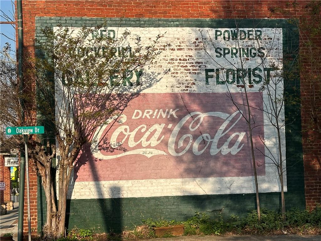 4659 Larkfield Way, Unit 15 Powder Springs, GA 30127 - Photo 49 of 60 a sign on the side of a building