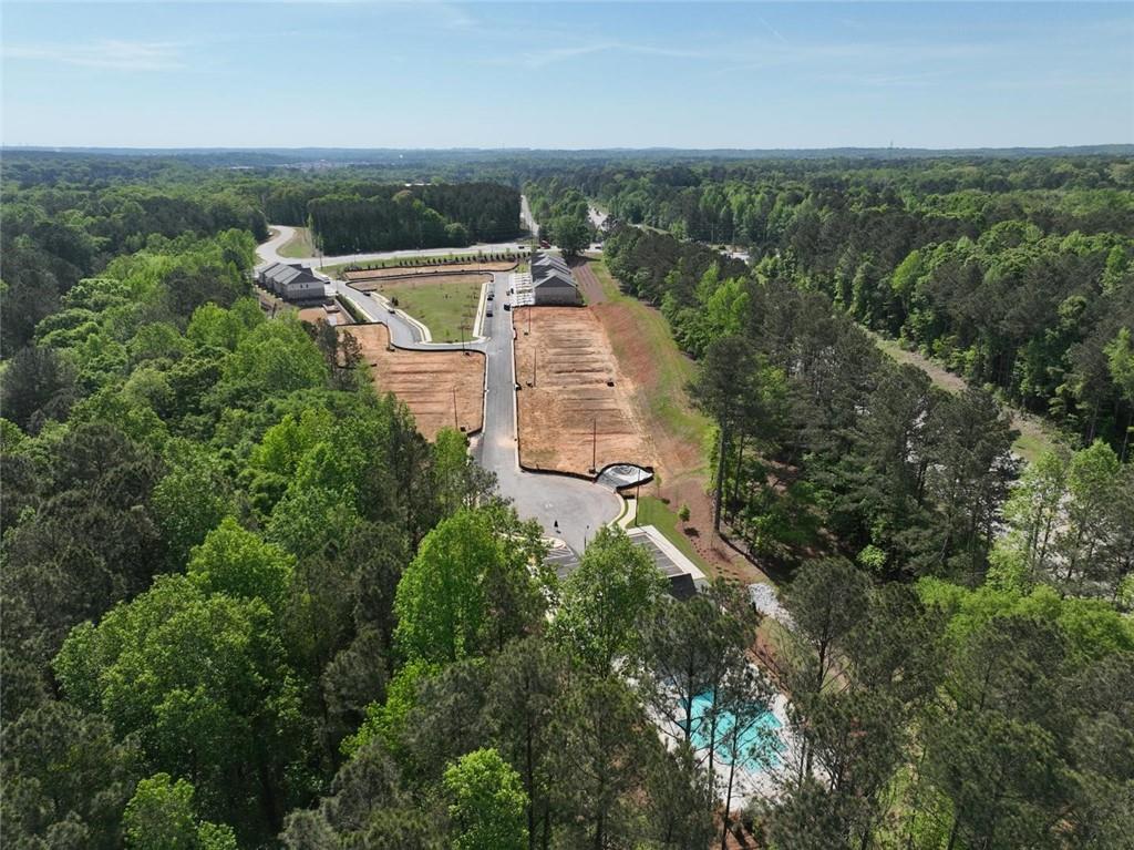 4659 Larkfield Way, Unit 15 Powder Springs, GA 30127 - Photo 58 of 60 an aerial view of a house with a yard and lake view
