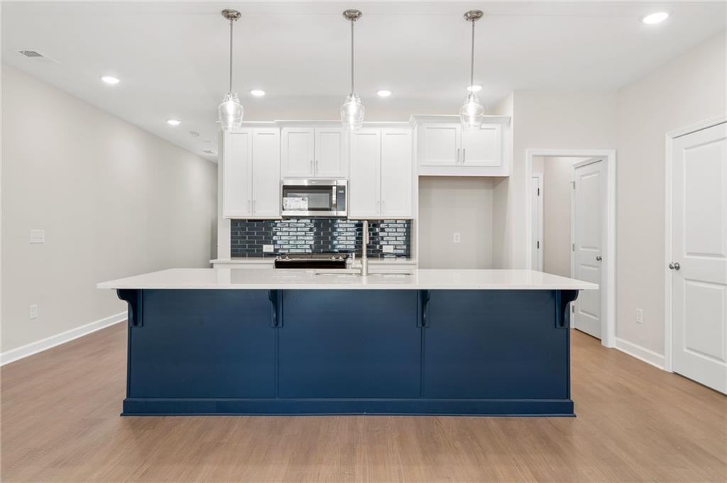 4659 Larkfield Way, Unit 15 Powder Springs, GA 30127 - Photo 8 of 60 a view of kitchen with stainless steel appliances granite countertop cabinets and stove