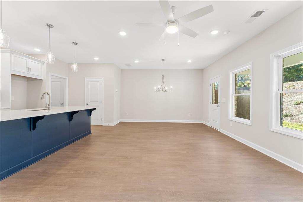 4659 Larkfield Way, Unit 15 Powder Springs, GA 30127 - Photo 10 of 60 a view of an empty room with windows and cabinet