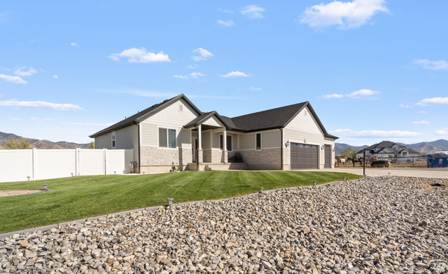 3678 Spiral Springs Road, Unit 204 Tooele, UT 84074 - Photo 54 of 59 Contemporary ranch-style residence featuring a combination of horizontal siding and stone veneer