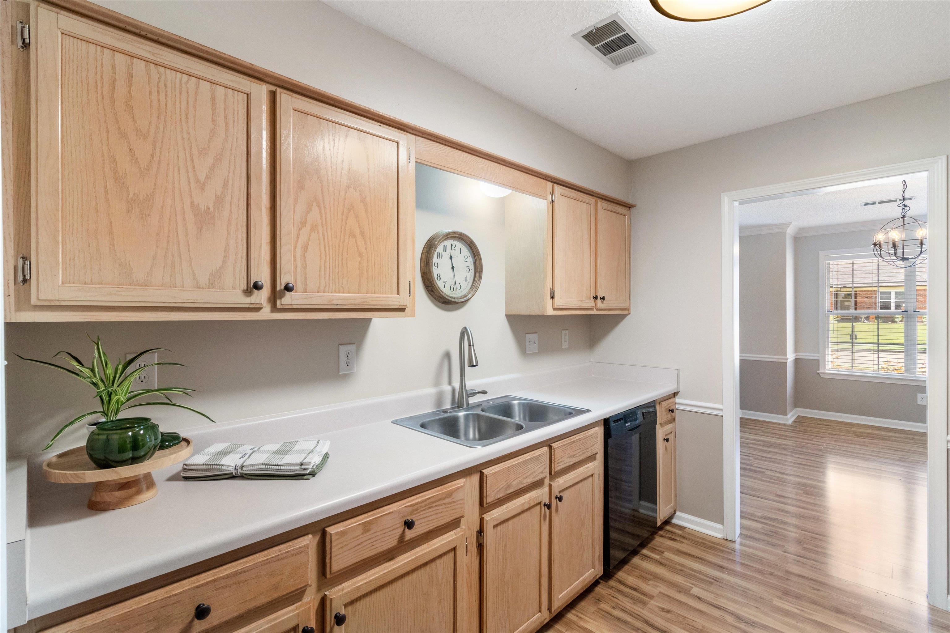465 Harts Way Drive Collierville, TN 38017 - Photo 12 of 29 a kitchen with stainless steel appliances granite countertop a sink a stove and a wooden floors