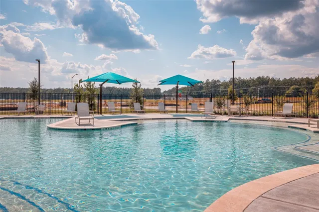 a view of pool with outdoor seating