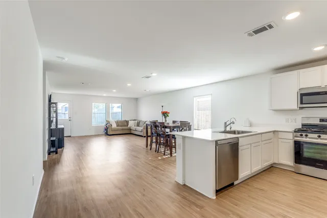 a view of a kitchen and dining room