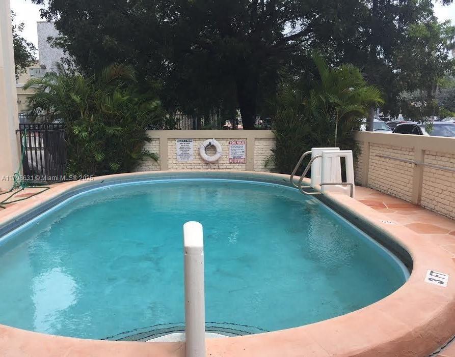 1100 Alton Road, Unit 3D Miami Beach, FL 33139 - Photo 14 of 14 a view of a wooden fence