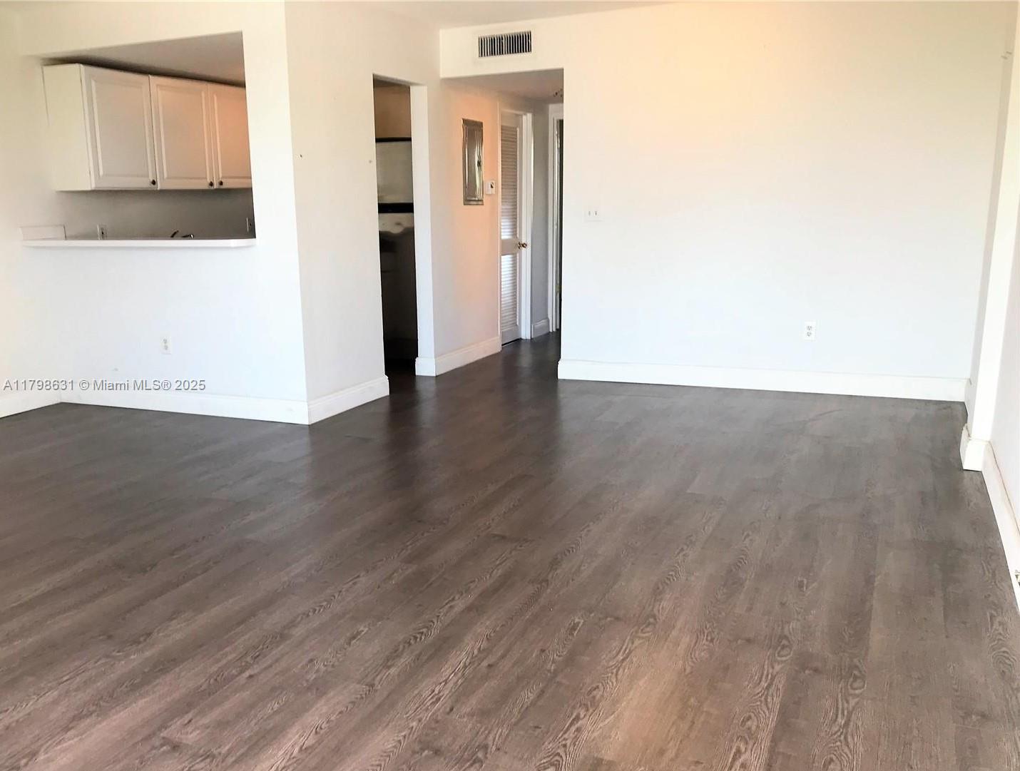 1100 Alton Road, Unit 3D Miami Beach, FL 33139 - Photo 4 of 14 a view of a kitchen with wooden floor