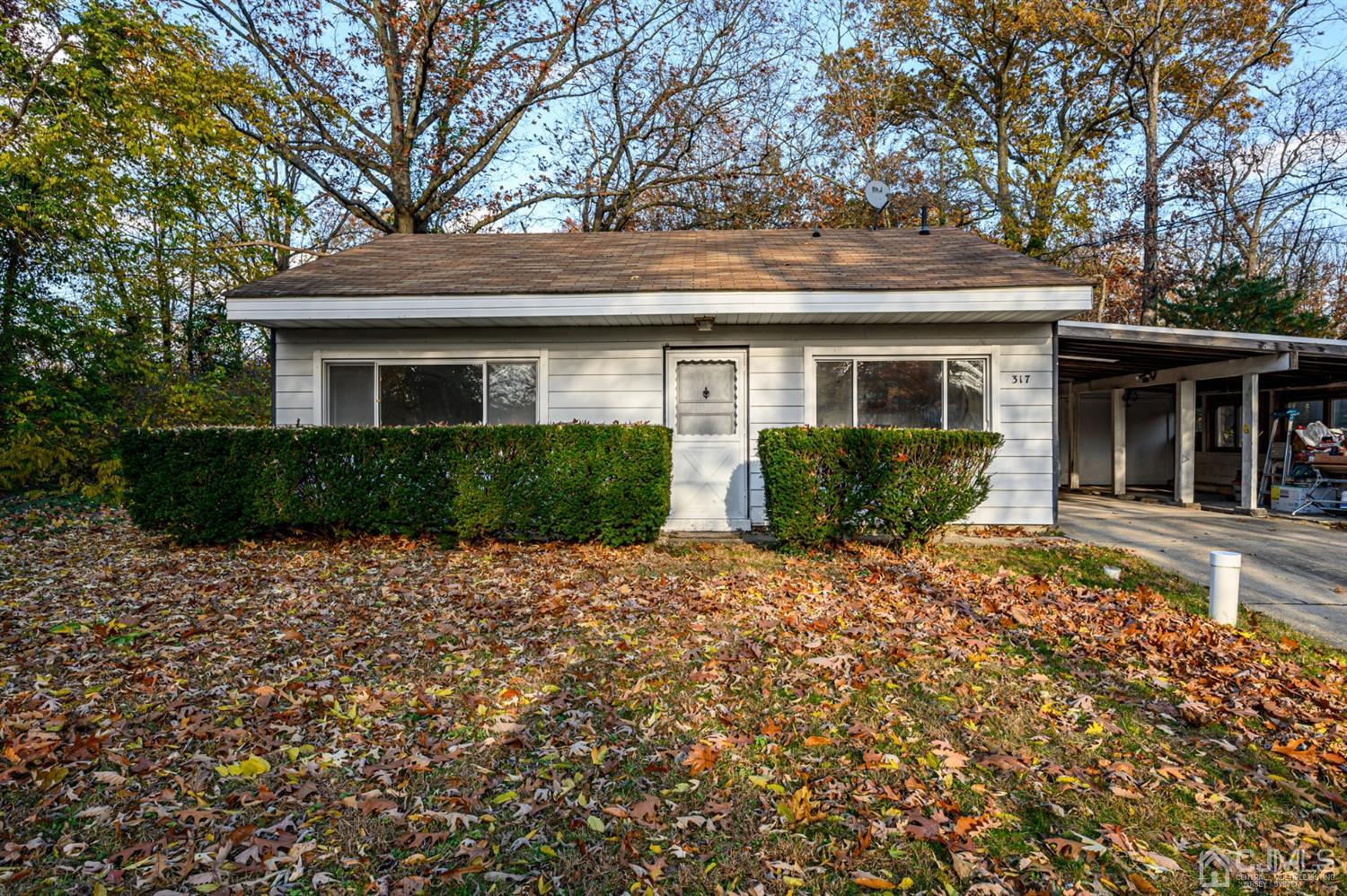 317 Maple Road Mount Laurel, NJ 08054 - Photo 1 of 38 a front view of a house with garden