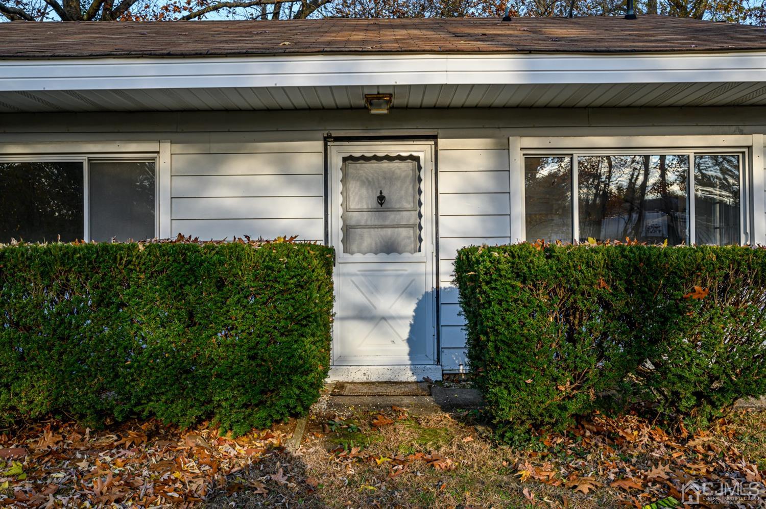317 Maple Road Mount Laurel, NJ 08054 - Photo 2 of 38 a view of front door and potted plants