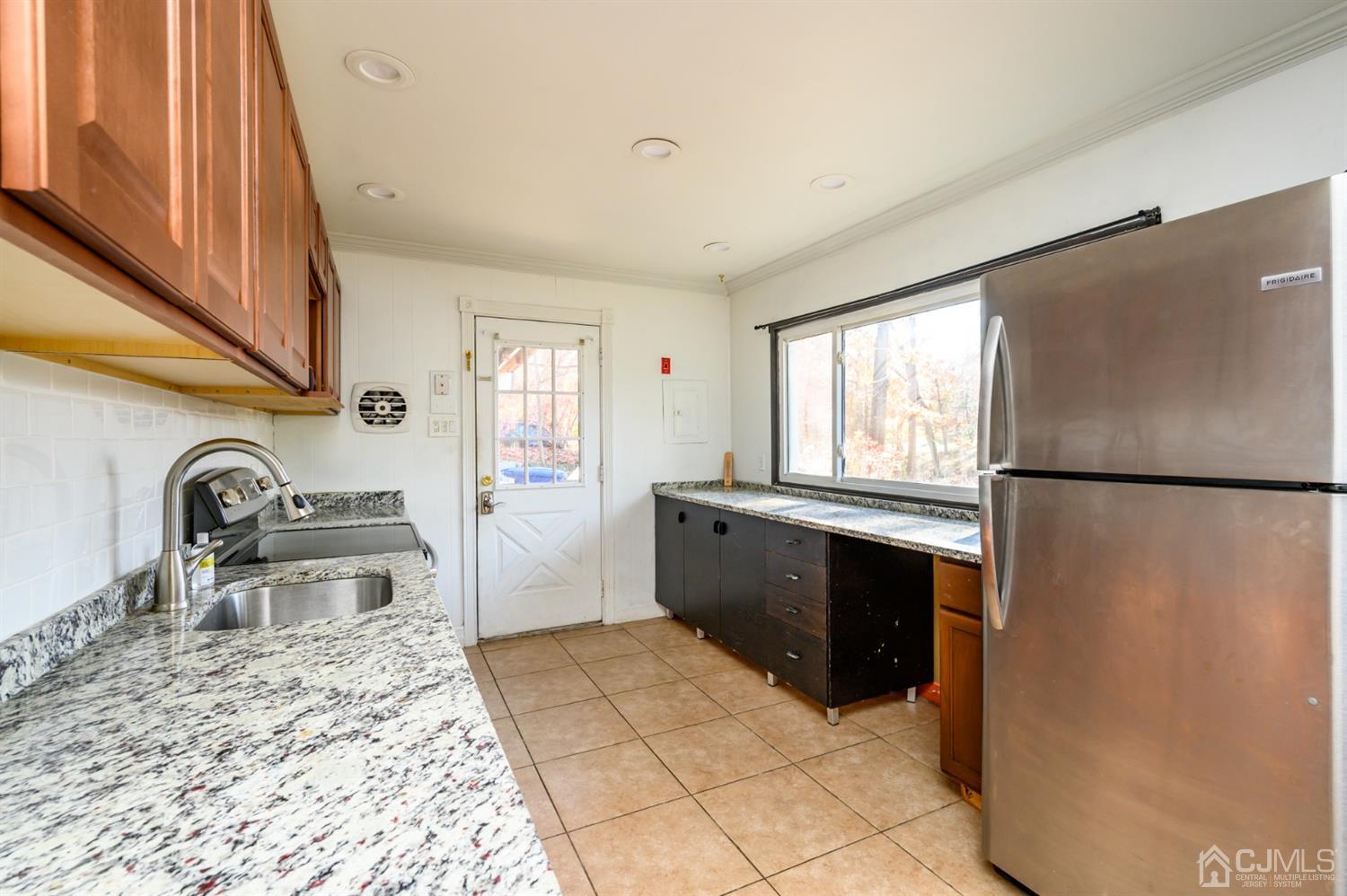 317 Maple Road Mount Laurel, NJ 08054 - Photo 11 of 38 a kitchen with stainless steel appliances granite countertop a refrigerator and a sink