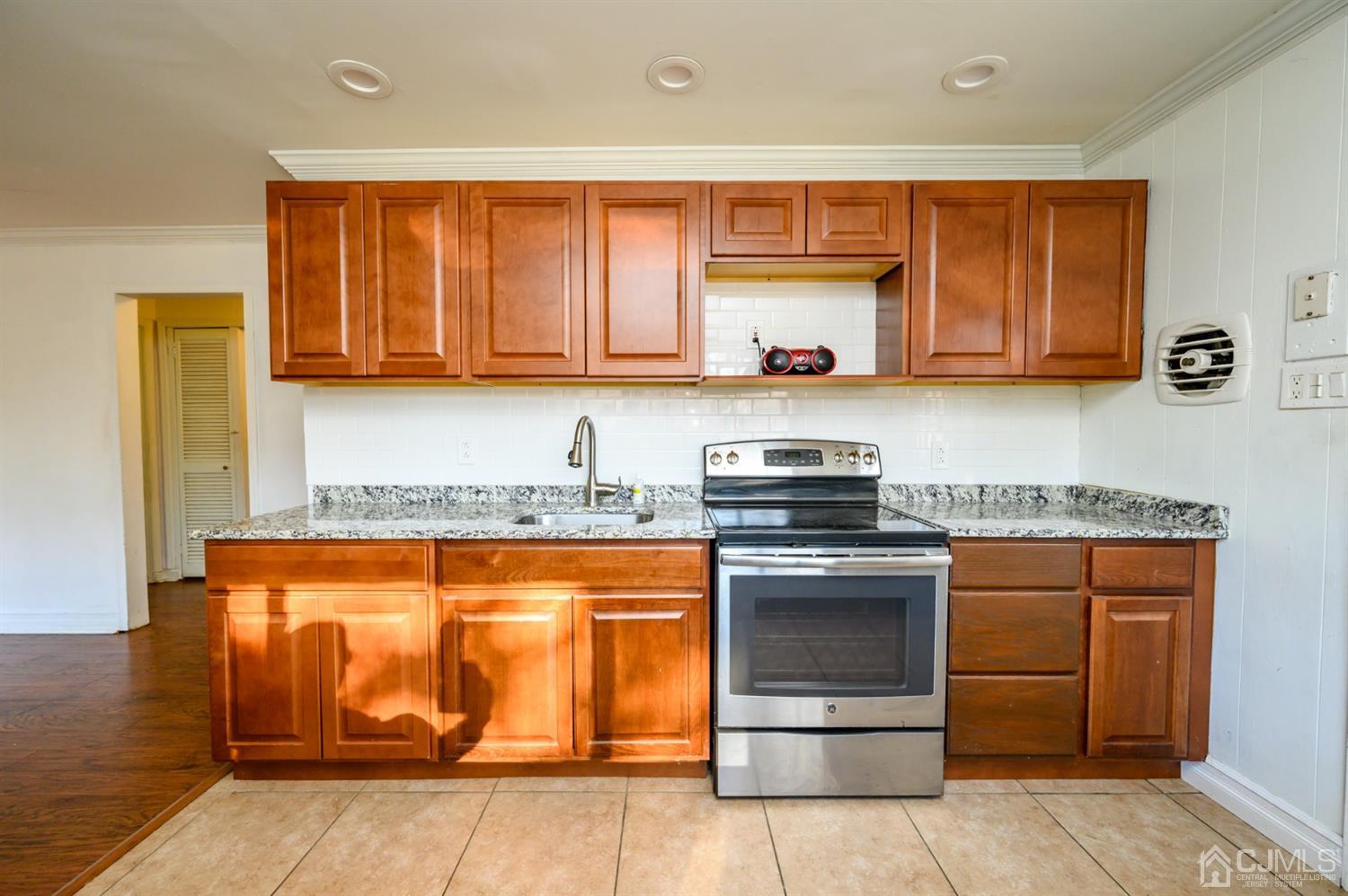 317 Maple Road Mount Laurel, NJ 08054 - Photo 13 of 38 a kitchen with stainless steel appliances granite countertop a stove and a sink