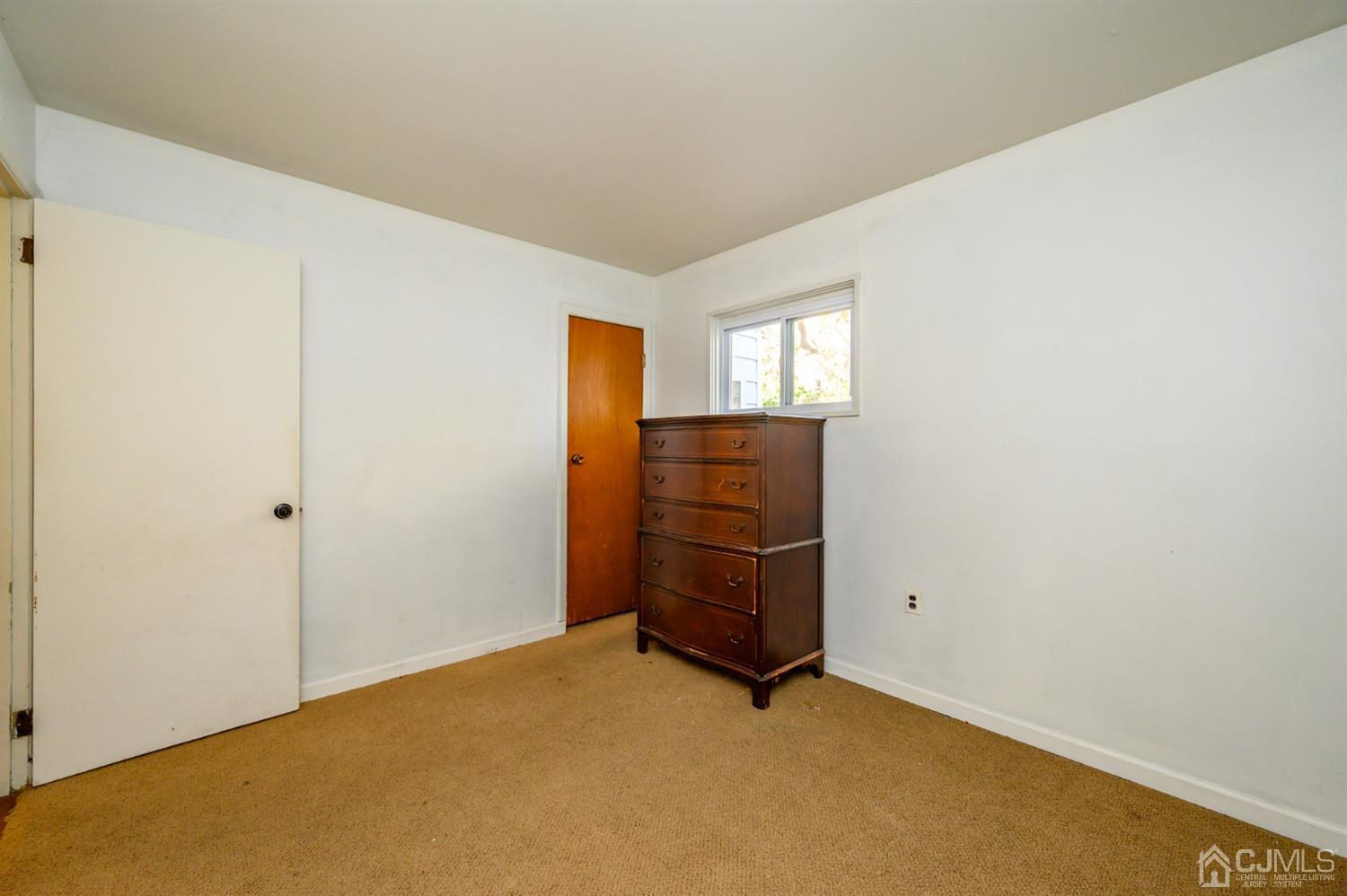 317 Maple Road Mount Laurel, NJ 08054 - Photo 22 of 38 an empty room with windows and cabinet