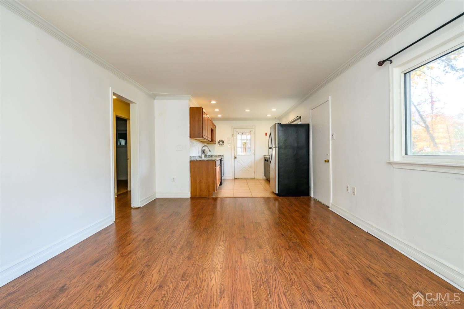 317 Maple Road Mount Laurel, NJ 08054 - Photo 8 of 38 a view of empty room with wooden floor and windows