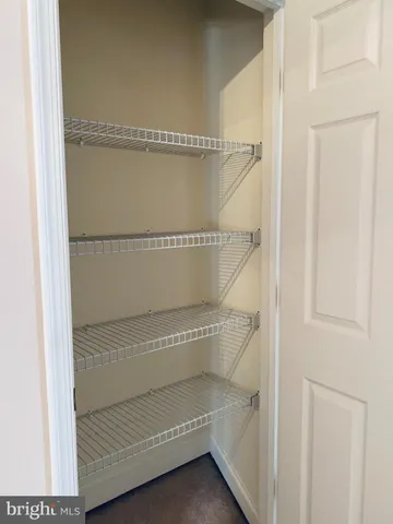 a front view of a building and trees