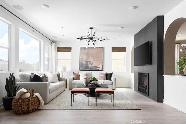 a living room with fireplace furniture and a flat screen tv