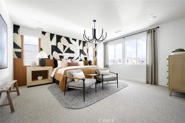 a bedroom with furniture and a window