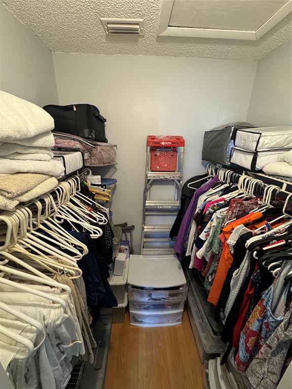 5681 Riverside Drive, Unit 203 Pompano Beach, FL 33067 - Photo 14 of 14 a bedroom with a bed and wooden floor