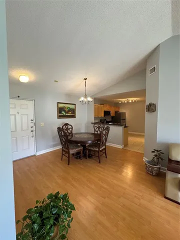 a view of a dining room with furniture