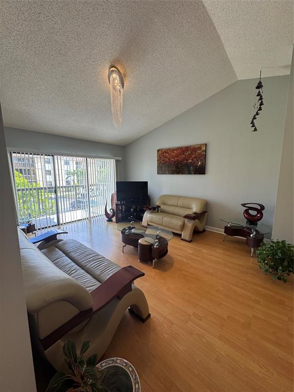 5681 Riverside Drive, Unit 203 Pompano Beach, FL 33067 - Photo 4 of 14 a bedroom with furniture