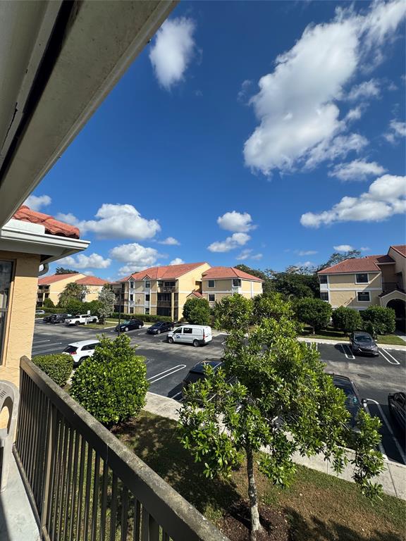 5681 Riverside Drive, Unit 203 Pompano Beach, FL 33067 - Photo 10 of 14 a view of a pathway both side of building