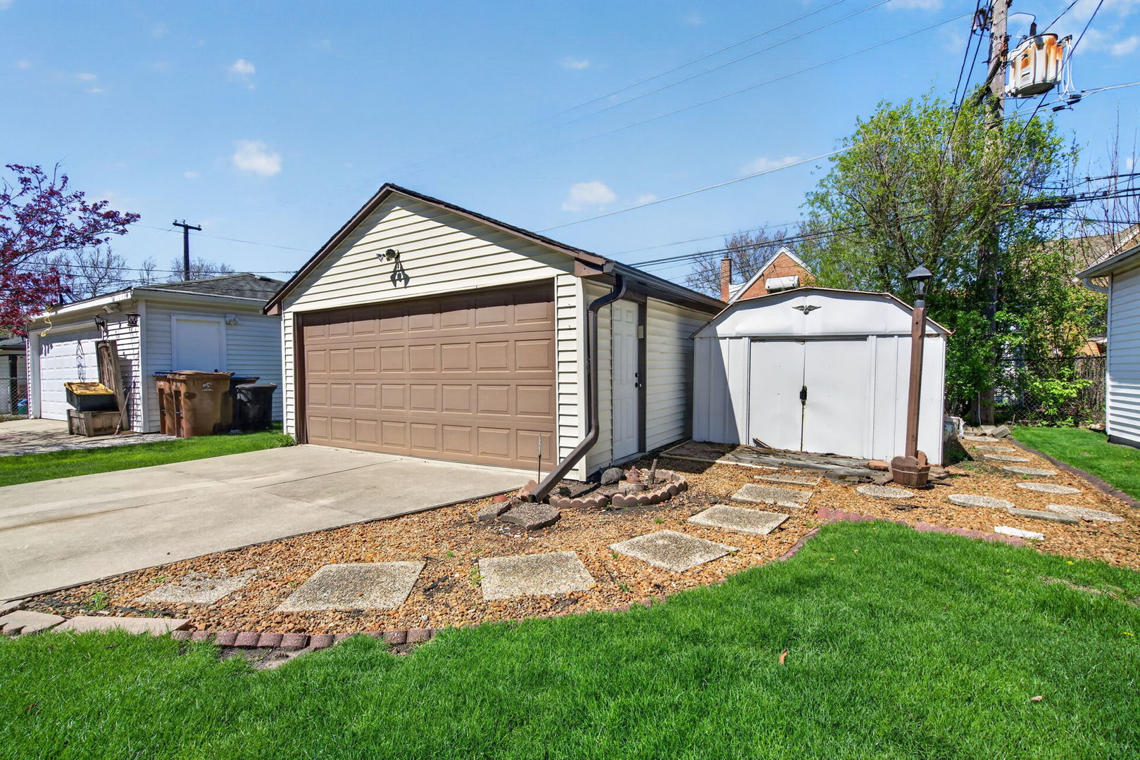 9020 West Forestview Drive North Riverside, IL 60546 - Photo 19 of 19 a front view of a house with a yard and garage