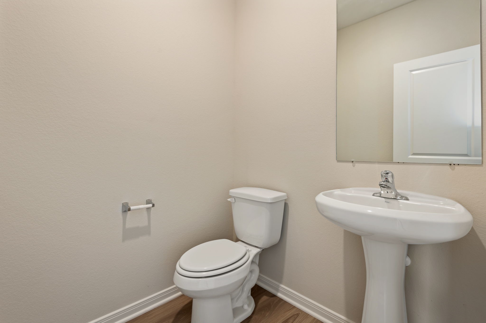 10377 Red Cardinal Drive Cleveland, TX 77328 - Photo 12 of 25 a bathroom with a sink a toilet and mirror