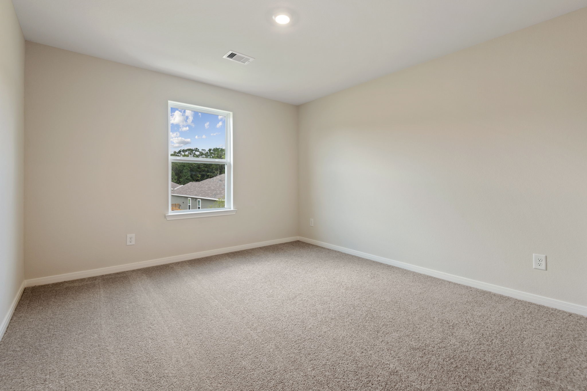 10377 Red Cardinal Drive Cleveland, TX 77328 - Photo 14 of 25 an empty room with a window