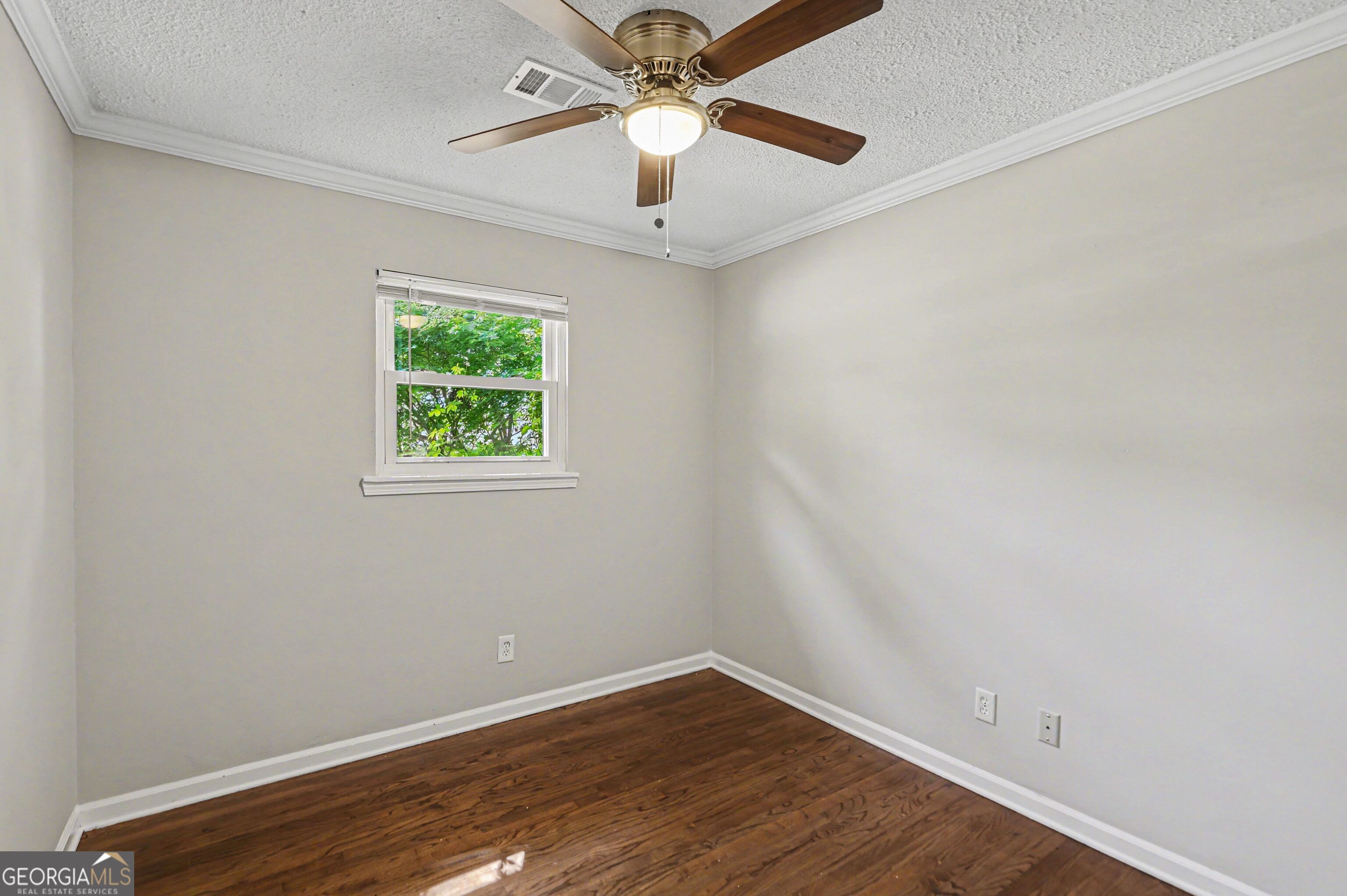 3670 Goodwin Road Austell, GA 30106 - Photo 11 of 16 an empty room with a window and a fan