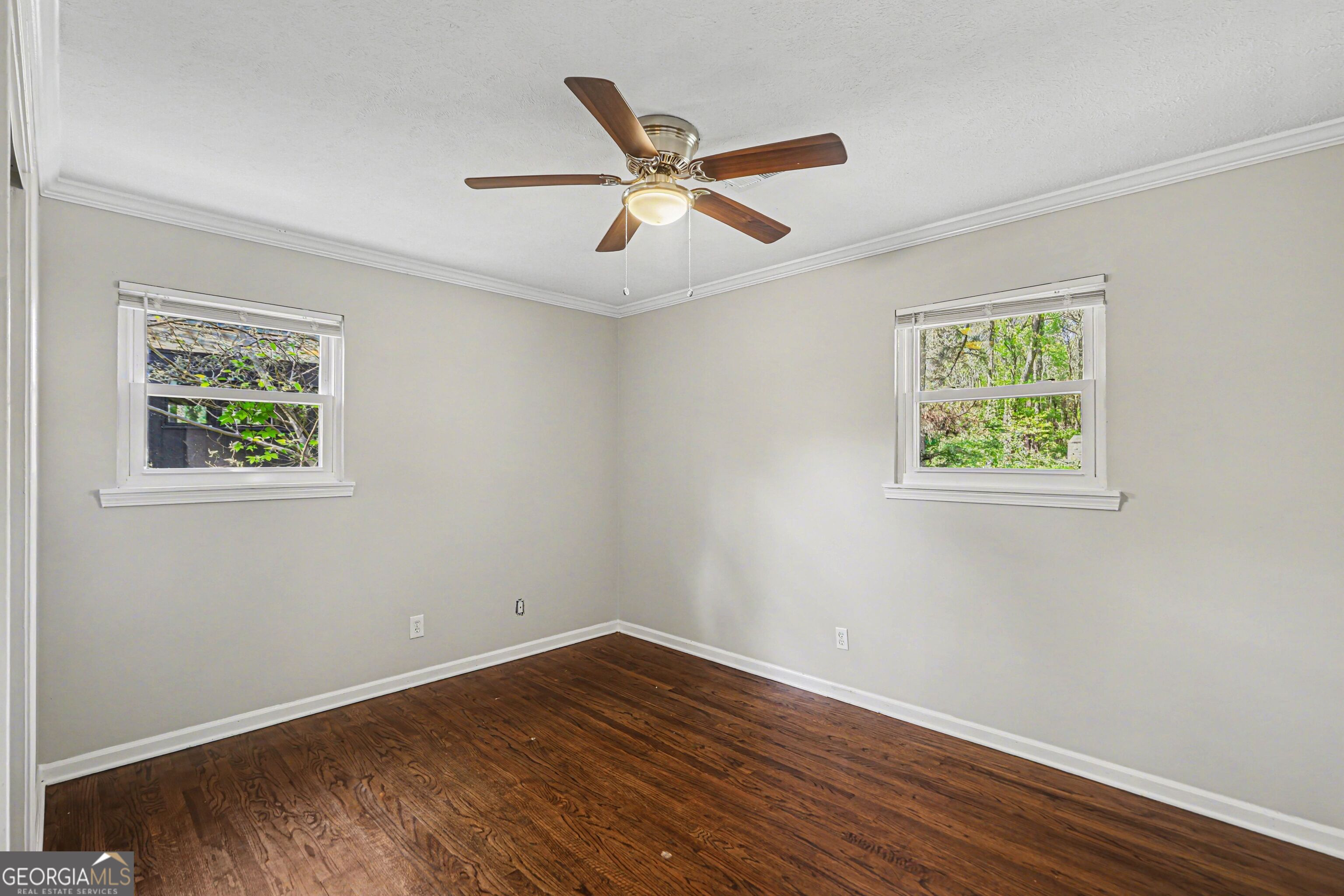 3670 Goodwin Road Austell, GA 30106 - Photo 12 of 16 a view of an empty room with wooden floor and a window