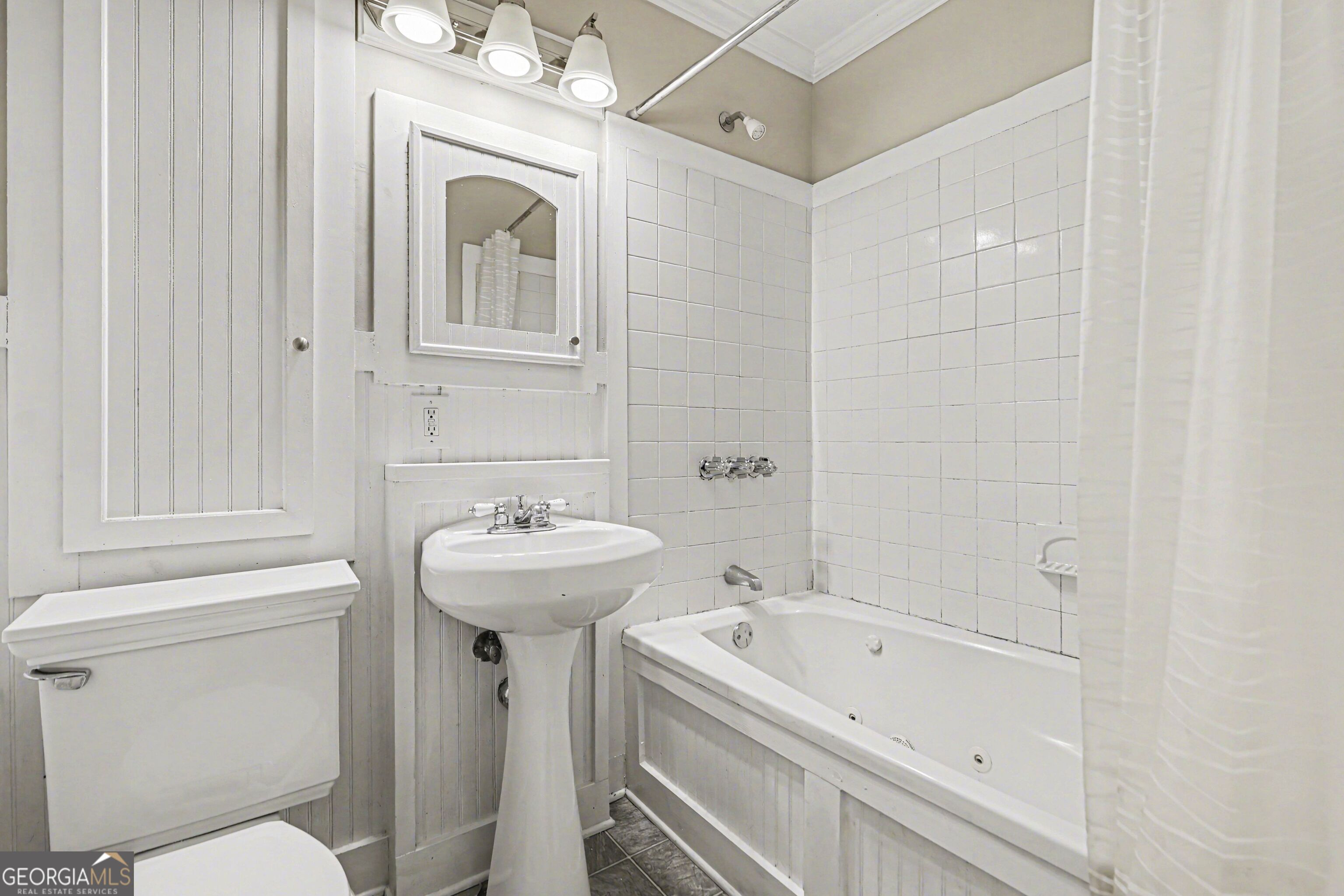 3670 Goodwin Road Austell, GA 30106 - Photo 14 of 16 a bathroom with a sink a toilet and a bathtub