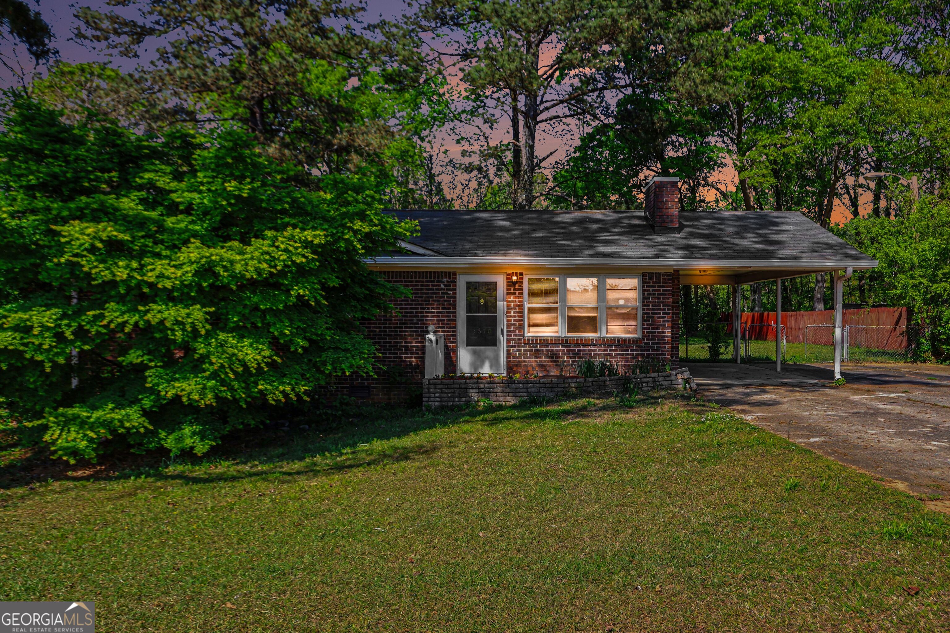 3670 Goodwin Road Austell, GA 30106 - Photo 2 of 16 a front view of a house with a garden