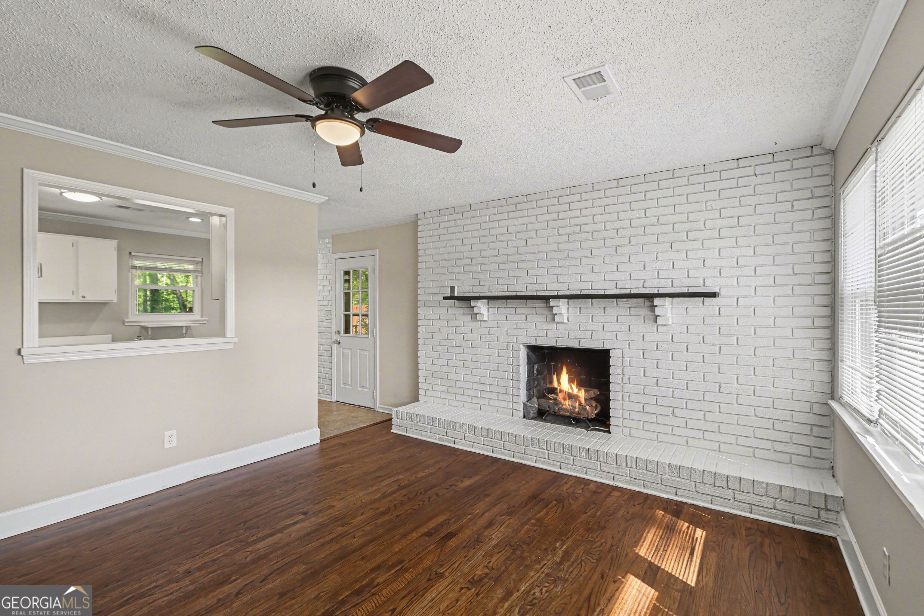 3670 Goodwin Road Austell, GA 30106 - Photo 4 of 16 a view of empty room with wooden floor and fan