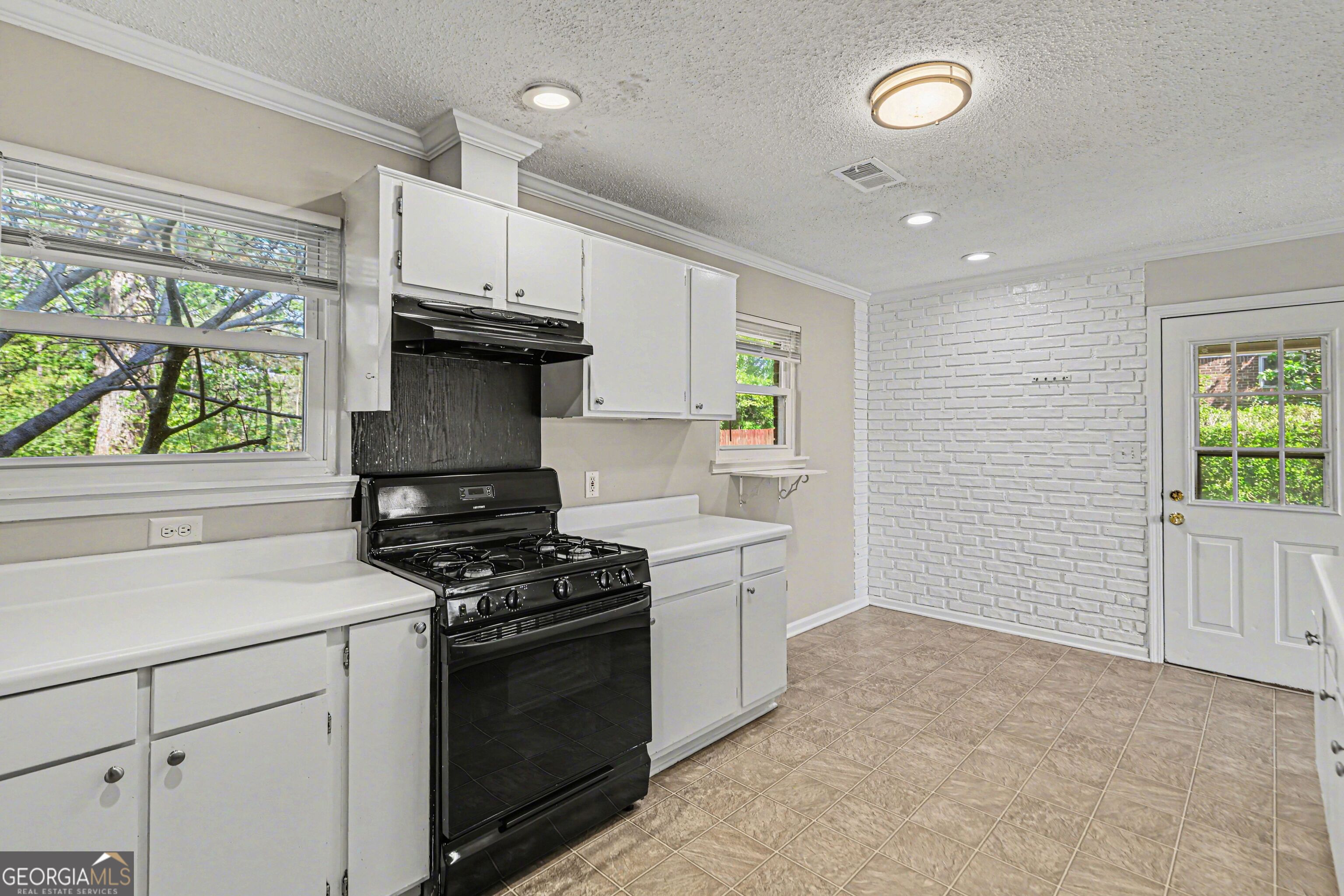 3670 Goodwin Road Austell, GA 30106 - Photo 8 of 16 a kitchen with a stove and a sink
