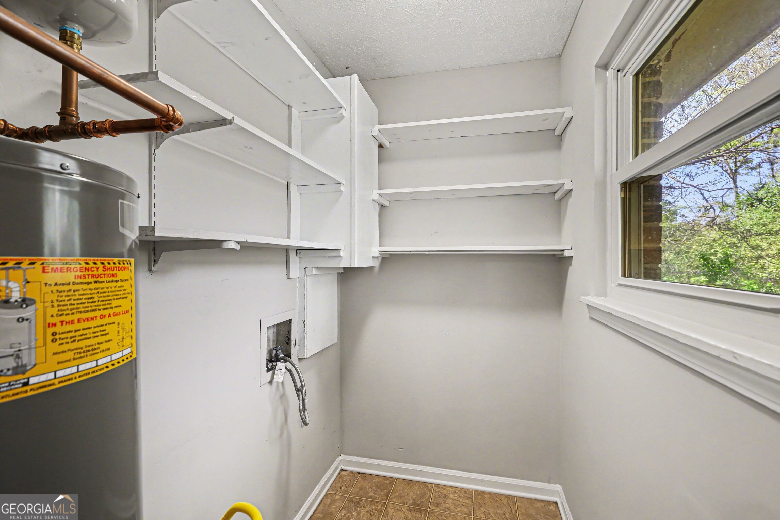 3670 Goodwin Road Austell, GA 30106 - Photo 10 of 16 a view of walk in closet with empty racks