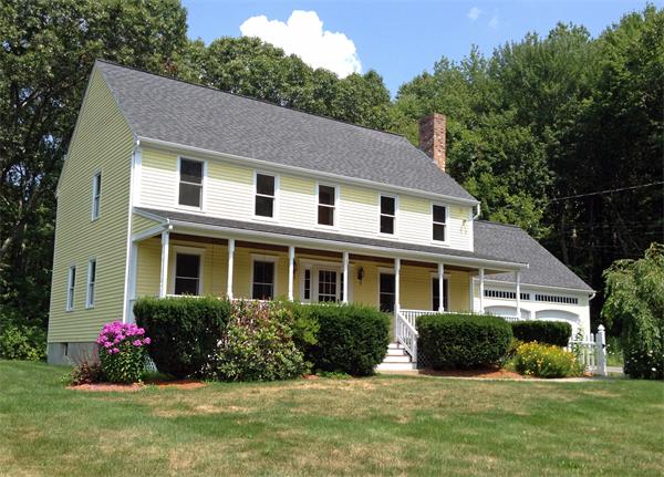 15 McGuire Road Sutton, MA 01590 - Photo 1 of 30 a front view of a house with a yard and potted plants