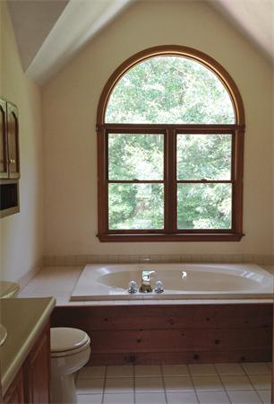15 McGuire Road Sutton, MA 01590 - Photo 19 of 30 a bath tub sitting next to a window