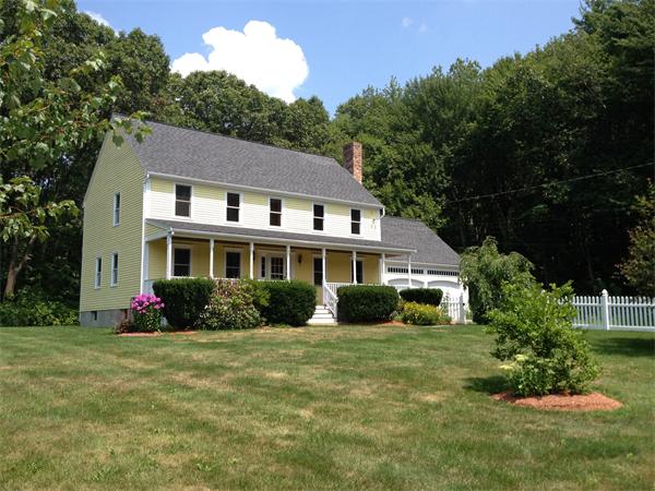 15 McGuire Road Sutton, MA 01590 - Photo 25 of 30 a front view of a house with a garden